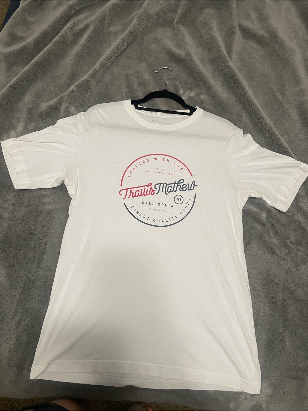 Travis Mathew White Short-Sleeve Tee with Red and Navy Logo